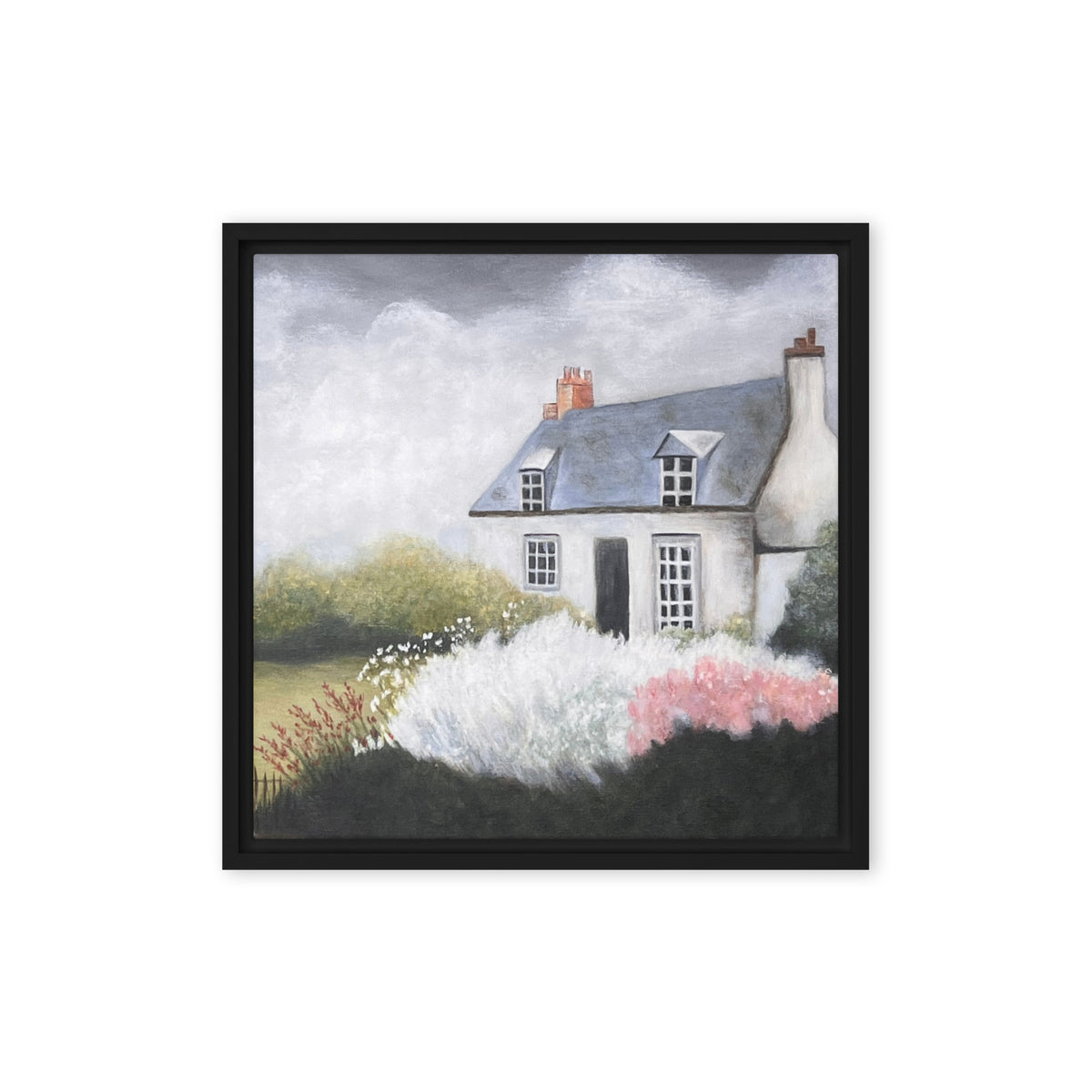 Framed artwork of a quaint house with a garden on a white background