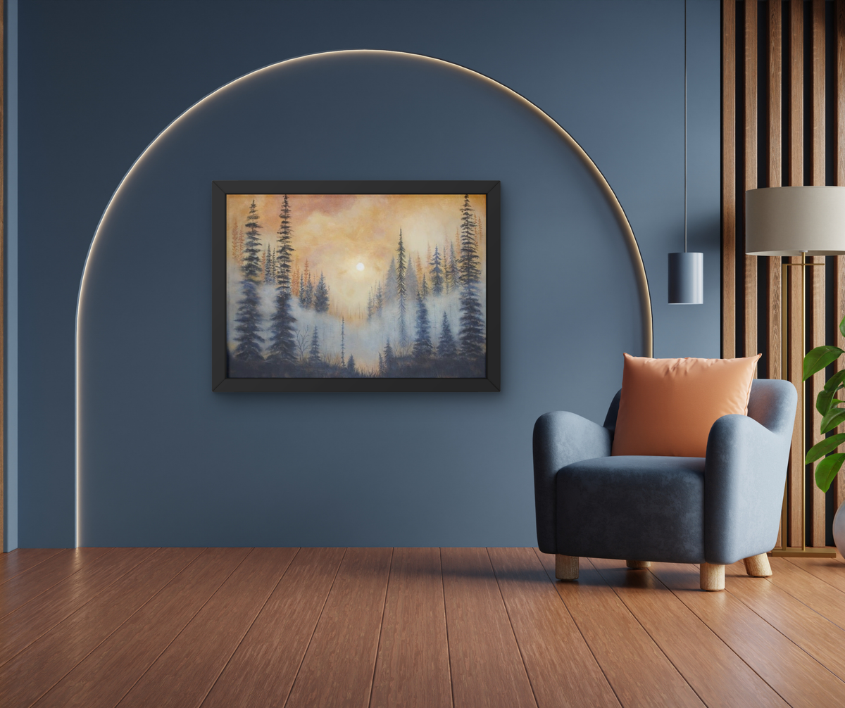 A framed landscape painting of a misty pine forest at sunrise, displayed on a dark blue wall in a modern living room setting with a blue armchair, wooden floor, and a large arched floor lamp.